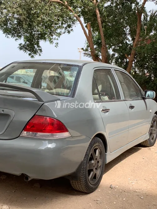 ميتسوبيشي لانسر بومة 2007 أبيض مستعملة للبيع - 5