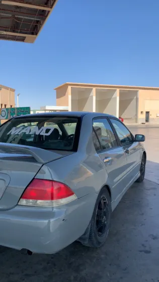 ميتسوبيشي لانسر بومة 2007 أبيض مستعملة للبيع