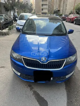 سكودا رابيد سبيس باك 2015 أبيض مستعملة للبيع