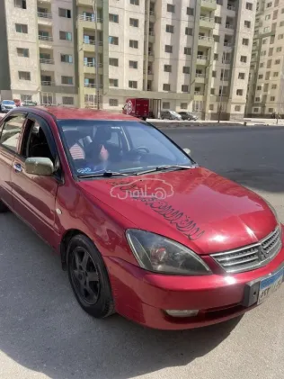 ميتسوبيشي لانسر بومة 2008 أحمر مستعملة للبيع