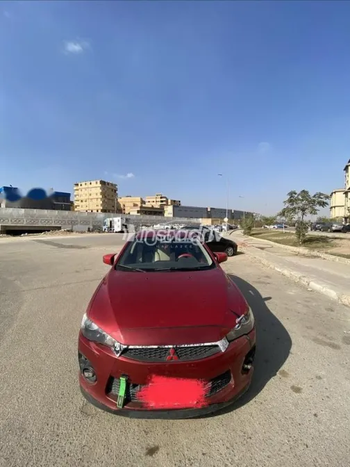 ميتسوبيشي لانسر اى اكس شارك 2016 أحمر غامق مستعملة للبيع - 1