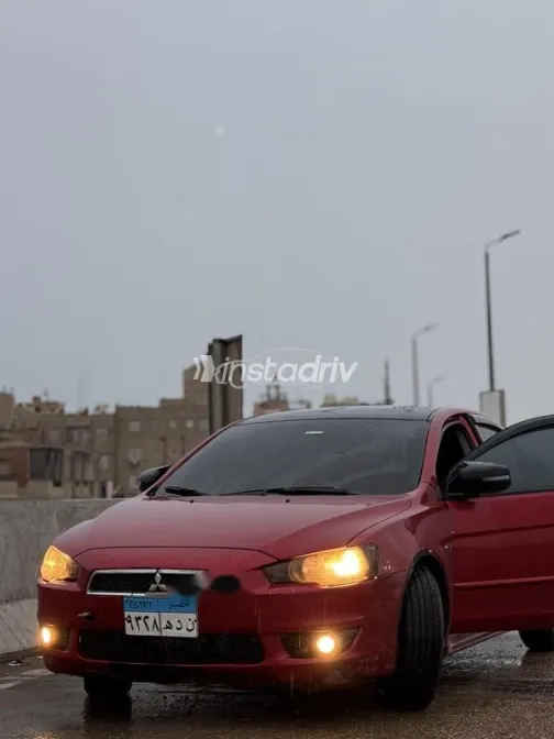 ميتسوبيشي لانسر اى اكس شارك 2015 أحمر غامق مستعملة للبيع - 2