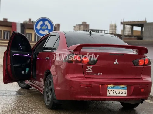 ميتسوبيشي لانسر اى اكس شارك 2015 أحمر غامق مستعملة للبيع - 4