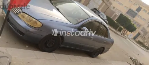 نيسان صنى 2005 أزرق غامق مستعملة للبيع - 1