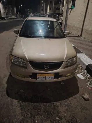 مازدا 323 2002 ذهبي مستعملة للبيع