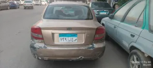 كيا ريو 2003 ذهبي مستعملة للبيع