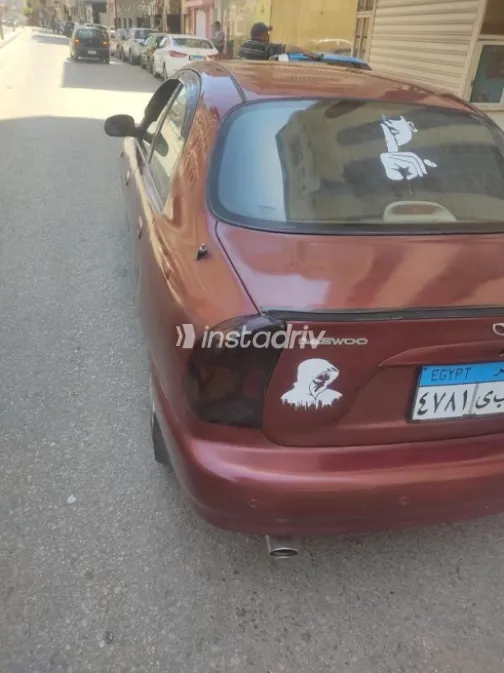دايو لانوس 2002 أحمر غامق مستعملة للبيع - 7