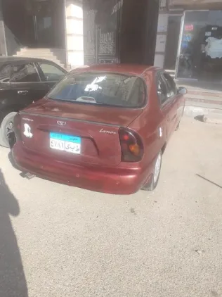 دايو لانوس 2002 أحمر غامق مستعملة للبيع