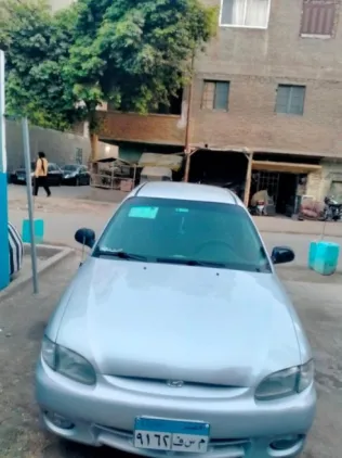 هيونداي اكسنت 2001 أحمر غامق مستعملة للبيع