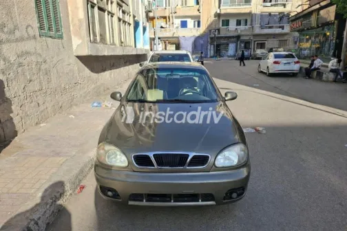 دايو لانوس 2002 ذهبي مستعملة للبيع - 1