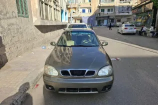 دايو لانوس 2002 ذهبي مستعملة للبيع