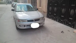 ميتسوبيشي لانسر 1998 فضي مستعملة للبيع