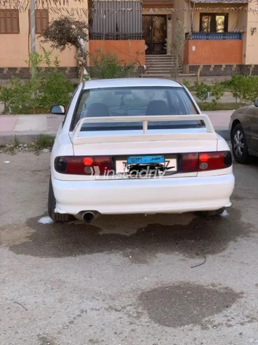 ميتسوبيشي لانسر 1993 أبيض مستعملة للبيع - 9