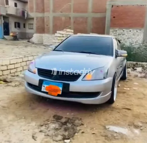 ميتسوبيشي لانسر 2006 فضي مستعملة للبيع - 1