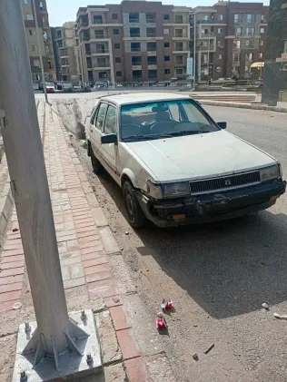 تويوتا كورولا 1986 أبيض مستعملة للبيع
