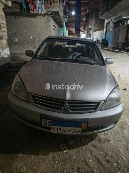 ميتسوبيشي لانسر بومة 2006 ذهبي مستعملة للبيع - 1