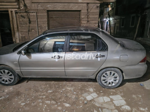 ميتسوبيشي لانسر بومة 2006 ذهبي مستعملة للبيع - 2