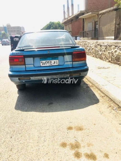 ميتسوبيشي لانسر 1991 سماوي مستعملة للبيع - 5