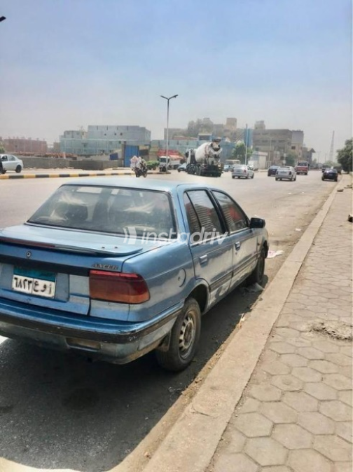 ميتسوبيشي لانسر 1991 سماوي مستعملة للبيع - 7