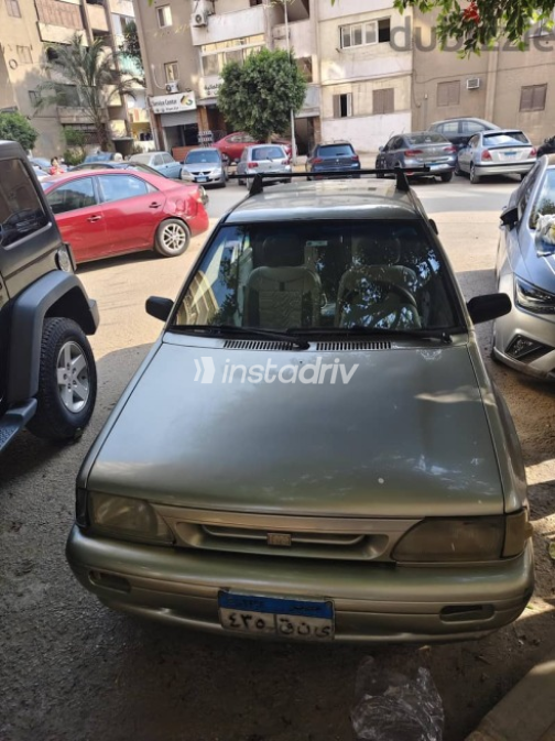كيا برايد 2000 ذهبي مستعملة للبيع - 1