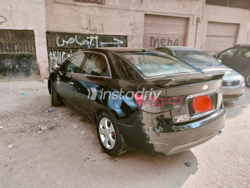 كيا سيراتو 2010 أسود مستعملة للبيع - 1