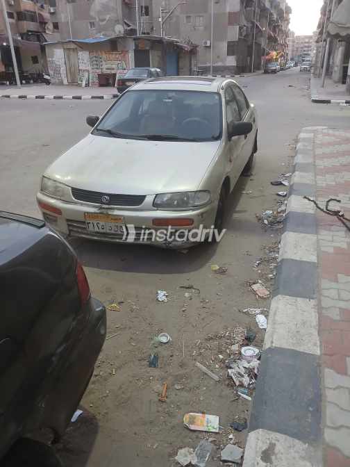 Mazda 323 1996 Gold Used for Sale - 1