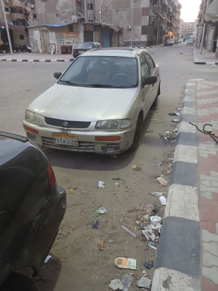 Mazda 323 1996 Gold Used for Sale