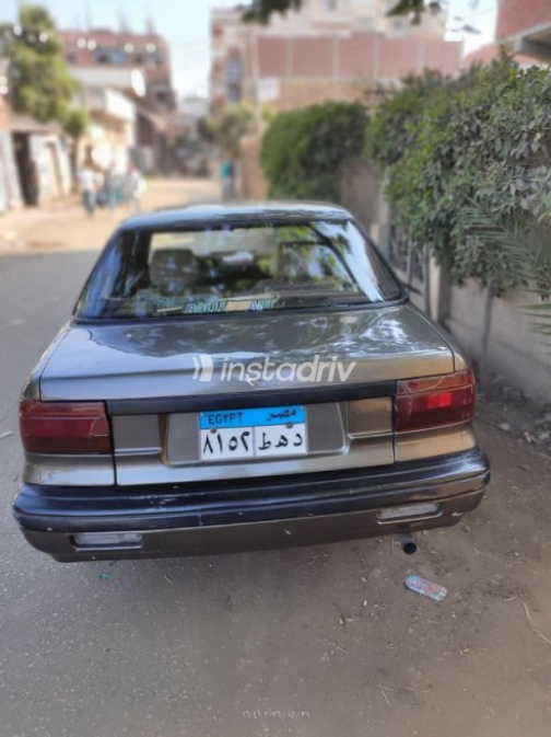 ميتسوبيشي لانسر 1991 بني مستعملة للبيع - 1