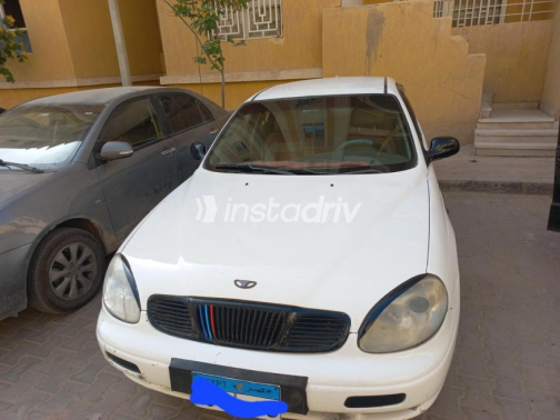 دايو ليوجانزا 2000 أبيض يدوي مستعملة للبيع في 6 أكتوبر - 2