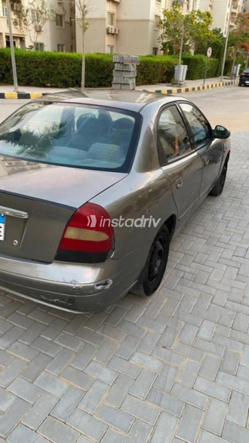 دايو نوبيرا 2 2001 ذهبي يدوي مستعملة للبيع في حدائق اكتوبر - 2