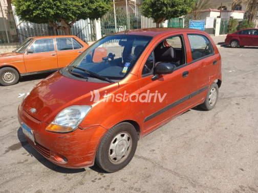 Chevrolet Spark 2009 Orange Manual Used for Sale in Nasr city - 4