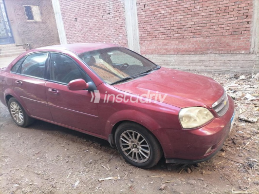 Chevrolet Optra 2009 Dark Red Automatic Used for Sale in Mit Ghamr - 6