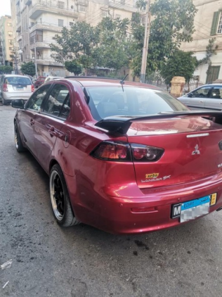 ميتسوبيشي لانسر اى اكس شارك 2016 أحمر غامق أوتوماتيك مستعملة للبيع في المنصورة