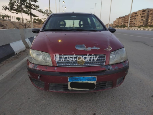 فيات بونتو 2011 أحمر غامق يدوي مستعملة للبيع في الجيزة - 2