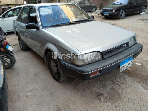 Mazda 323 1990 Silver Automatic Used for Sale in Greater Cairo ( Cairo + Giza) - 1