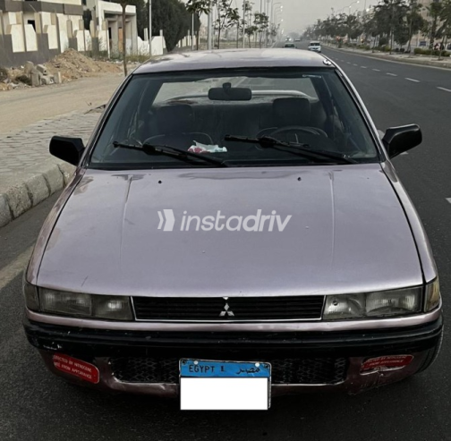 ميتسوبيشي لانسر 1990 بنفسجي يدوي مستعملة للبيع في حدائق اكتوبر - 1