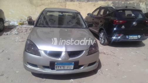 ميتسوبيشي لانسر 2006 ذهبي أوتوماتيك مستعملة للبيع في الإسكندرية - 1