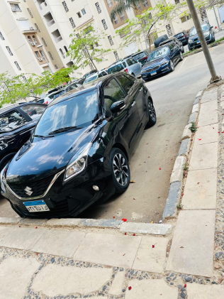 سوزوكى بالينو 2022 أسود أوتوماتيك مستعملة للبيع في مدينتى