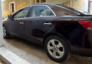 Kia Cerato 2010 Eggplant Automatic Used for Sale in Sharqia