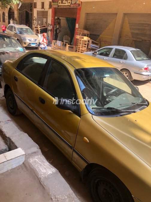 دايو لانوس 2 1999 ذهبي يدوي مستعملة للبيع في الهرم - 1