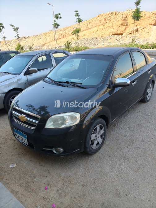 شيفروليه افيو 2010 أسود يدوي مستعملة للبيع في القاهرة - 1
