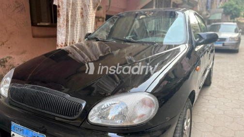 دايو لانوس 2 2002 أسود يدوي مستعملة للبيع في شبرا الخيمة - 6