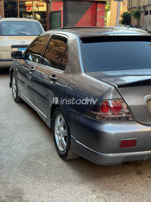 ميتسوبيشي لانسر 2006 رمادي غامق أوتوماتيك مستعملة للبيع في دمنهور - 1