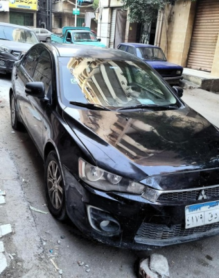 ميتسوبيشي لانسر 2015 أسود أوتوماتيك مستعملة للبيع في حدائق الاهرام