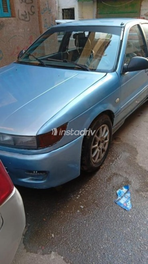 Mitsubishi Lancer 1990 Blue Manual Used for Sale in Nasr city - 1
