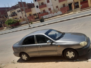 شيفروليه لانوس 2014 أبيض يدوي مستعملة للبيع في العاشر من رمضان