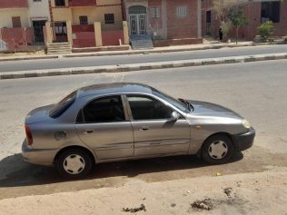 شيفروليه لانوس 2014 أبيض يدوي مستعملة للبيع في العاشر من رمضان