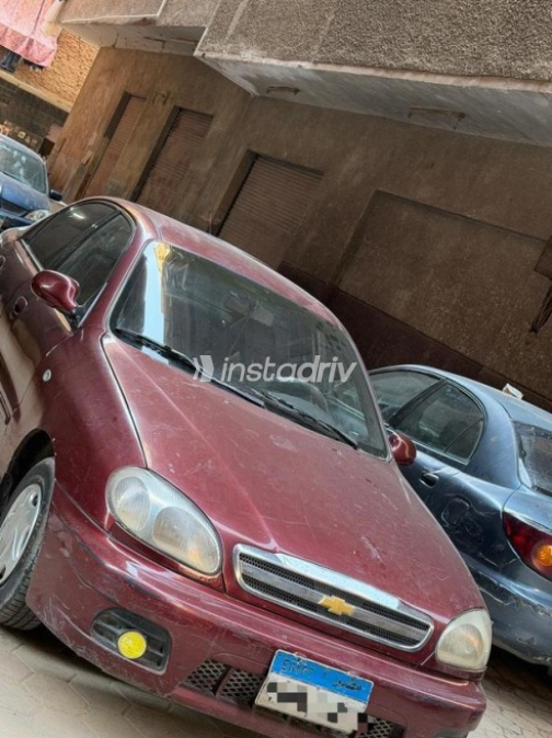 شيفروليه لانوس 2015 أحمر غامق يدوي مستعملة للبيع في القاهرة - 2