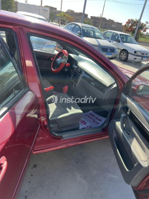 Chevrolet Optra 2011 Dark Red Automatic Used for Sale in El Minya - 8