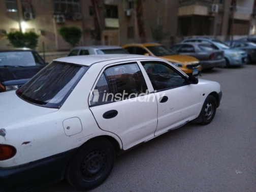 Mitsubishi Lancer 1992 White Manual Used for Sale in Nasr city - 4
